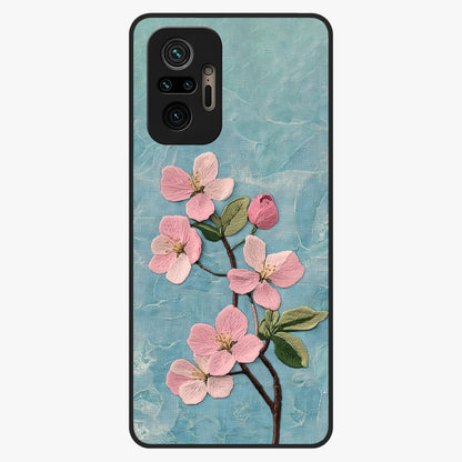 Threaded Blossom Breeze Glass Case showing flat back view with delicate blossom artwork and glossy glass finish.