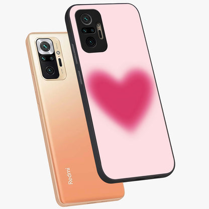 Pink Aura Heart Glass Case displayed in angled mockup highlighting vibrant pink heart design with dreamy aura aesthetic.