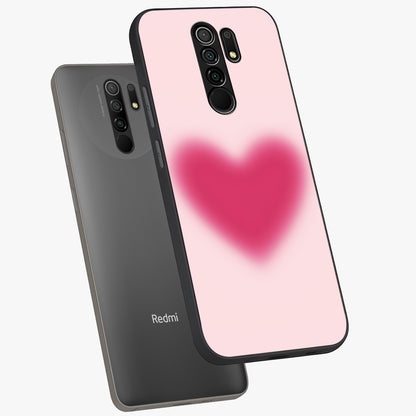 Pink Aura Heart Glass Case displayed in angled mockup highlighting vibrant pink heart design with dreamy aura aesthetic.