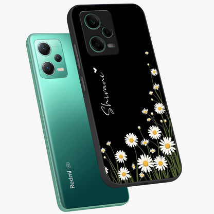 Daisy Cascade Custom Name Glass Case displayed in angled mockup highlighting delicate daisy artwork with custom name feature.