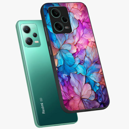 Radiant Floral Whirl Glass Case displayed in angled mockup highlighting vibrant flower pattern with dynamic artistic aesthetic.