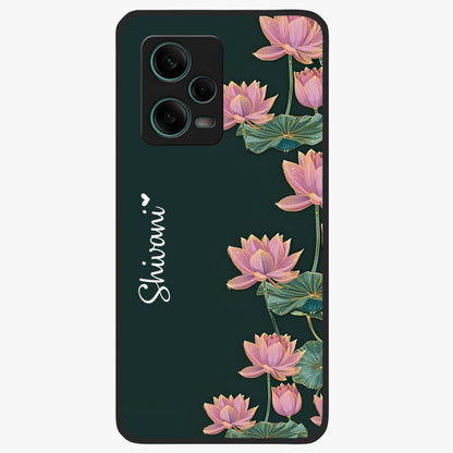 Lotus Bloom Serenity Custom Name Glass Case showing flat back view with elegant lotus flower artwork and personalized name design.