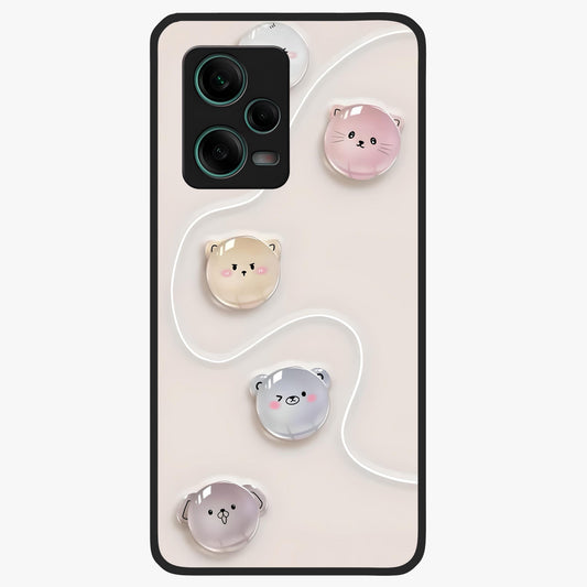 Puffy Face Parade Glass Case showing flat back view with cute puffy character faces artwork and glossy glass finish.
