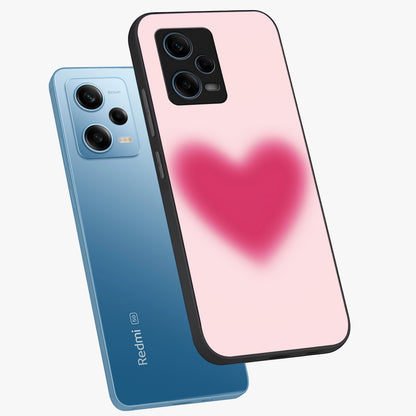 Pink Aura Heart Glass Case displayed in angled mockup highlighting vibrant pink heart design with dreamy aura aesthetic.