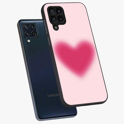 Pink Aura Heart Glass Case displayed in angled mockup highlighting vibrant pink heart design with dreamy aura aesthetic.