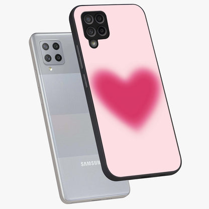 Pink Aura Heart Glass Case displayed in angled mockup highlighting vibrant pink heart design with dreamy aura aesthetic.