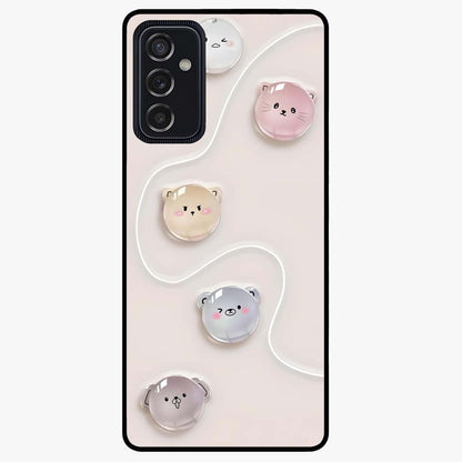 Puffy Face Parade Glass Case showing flat back view with cute puffy character faces artwork and glossy glass finish.