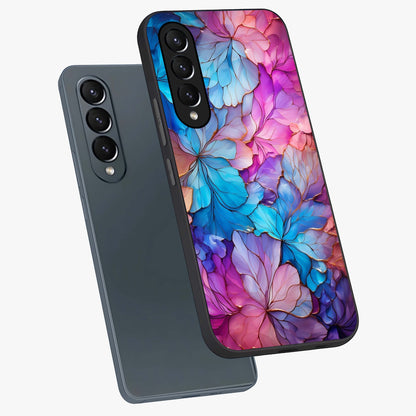 Radiant Floral Whirl Glass Case displayed in angled mockup highlighting vibrant flower pattern with dynamic artistic aesthetic.