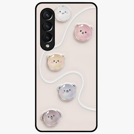 Puffy Face Parade Glass Case showing flat back view with cute puffy character faces artwork and glossy glass finish.