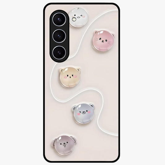 Puffy Face Parade Glass Case showing flat back view with cute puffy character faces artwork and glossy glass finish.