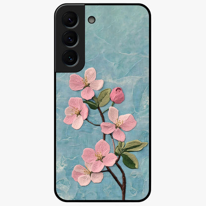 Threaded Blossom Breeze Glass Case showing flat back view with delicate blossom artwork and glossy glass finish.