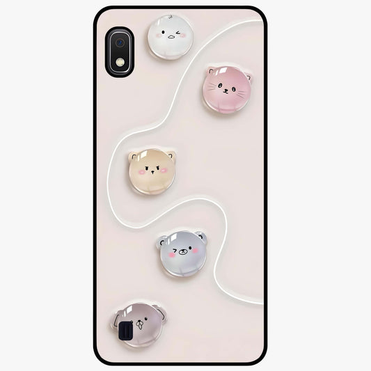 Puffy Face Parade Glass Case showing flat back view with cute puffy character faces artwork and glossy glass finish.
