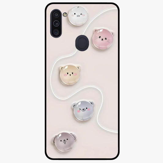 Puffy Face Parade Glass Case showing flat back view with cute puffy character faces artwork and glossy glass finish.