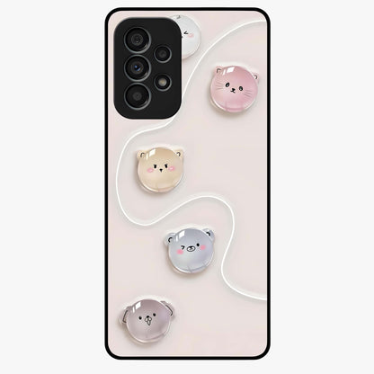 Puffy Face Parade Glass Case showing flat back view with cute puffy character faces artwork and glossy glass finish.