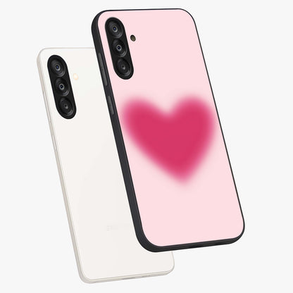Pink Aura Heart Glass Case displayed in angled mockup highlighting vibrant pink heart design with dreamy aura aesthetic.