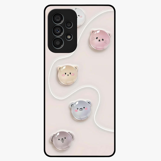 Puffy Face Parade Glass Case showing flat back view with cute puffy character faces artwork and glossy glass finish.