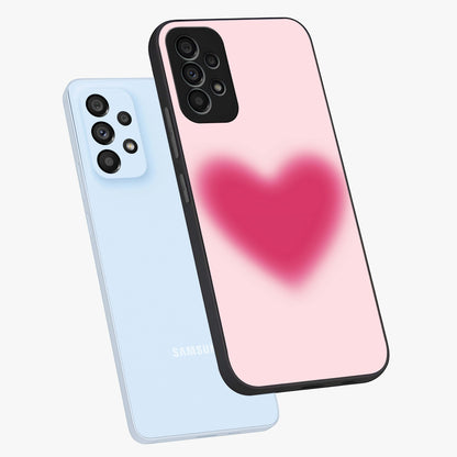 Pink Aura Heart Glass Case displayed in angled mockup highlighting vibrant pink heart design with dreamy aura aesthetic.