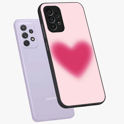 Pink Aura Heart Glass Case displayed in angled mockup highlighting vibrant pink heart design with dreamy aura aesthetic.