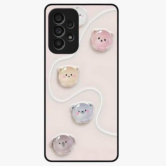 Puffy Face Parade Glass Case showing flat back view with cute puffy character faces artwork and glossy glass finish.