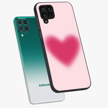 Pink Aura Heart Glass Case displayed in angled mockup highlighting vibrant pink heart design with dreamy aura aesthetic.