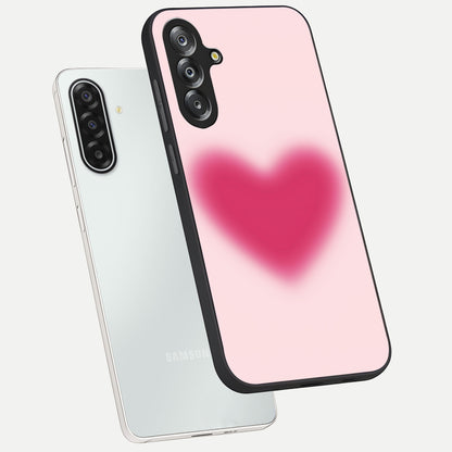 Pink Aura Heart Glass Case displayed in angled mockup highlighting vibrant pink heart design with dreamy aura aesthetic.