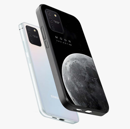 Cosmic Moon Glow Glass Case displayed in angled mockup highlighting celestial moon design with cosmic aesthetic theme.
