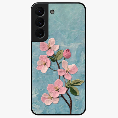 Threaded Blossom Breeze Glass Case showing flat back view with delicate blossom artwork and glossy glass finish.