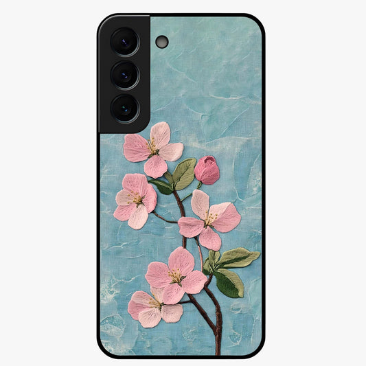 Threaded Blossom Breeze Glass Case showing flat back view with delicate blossom artwork and glossy glass finish.