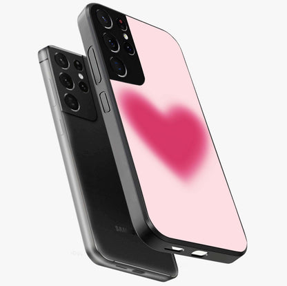Pink Aura Heart Glass Case displayed in angled mockup highlighting vibrant pink heart design with dreamy aura aesthetic.