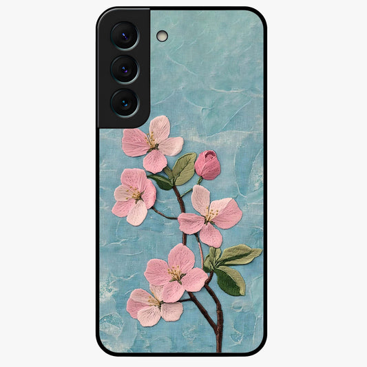 Threaded Blossom Breeze Glass Case showing flat back view with delicate blossom artwork and glossy glass finish.
