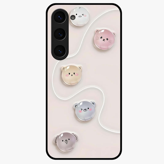 Puffy Face Parade Glass Case showing flat back view with cute puffy character faces artwork and glossy glass finish.