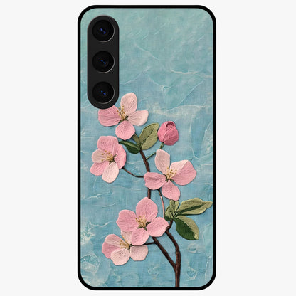 Threaded Blossom Breeze Glass Case showing flat back view with delicate blossom artwork and glossy glass finish.