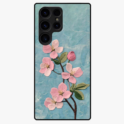 Threaded Blossom Breeze Glass Case showing flat back view with delicate blossom artwork and glossy glass finish.