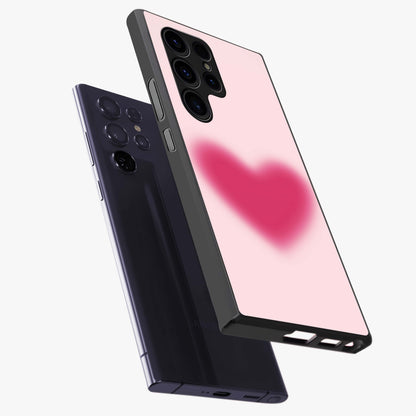 Pink Aura Heart Glass Case displayed in angled mockup highlighting vibrant pink heart design with dreamy aura aesthetic.