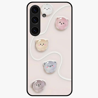 Puffy Face Parade Glass Case showing flat back view with cute puffy character faces artwork and glossy glass finish.