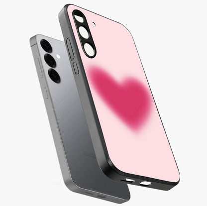 Pink Aura Heart Glass Case displayed in angled mockup highlighting vibrant pink heart design with dreamy aura aesthetic.