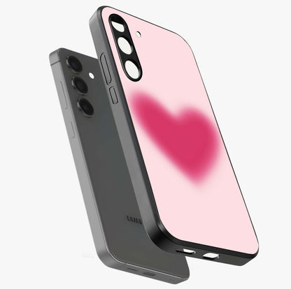 Pink Aura Heart Glass Case displayed in angled mockup highlighting vibrant pink heart design with dreamy aura aesthetic.