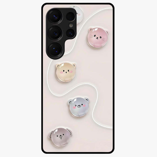 Puffy Face Parade Glass Case showing flat back view with cute puffy character faces artwork and glossy glass finish.