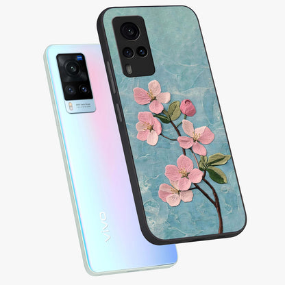 Threaded Blossom Breeze Glass Case displayed in angled mockup highlighting elegant floral design with soft aesthetic style.