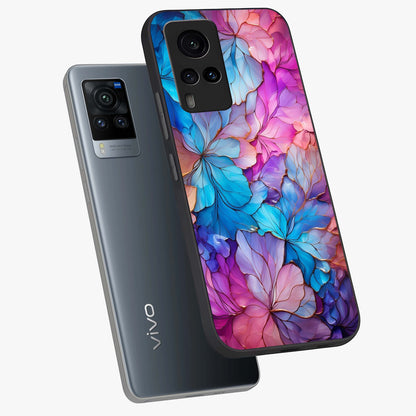 Radiant Floral Whirl Glass Case displayed in angled mockup highlighting vibrant flower pattern with dynamic artistic aesthetic.