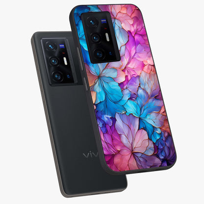 Radiant Floral Whirl Glass Case displayed in angled mockup highlighting vibrant flower pattern with dynamic artistic aesthetic.