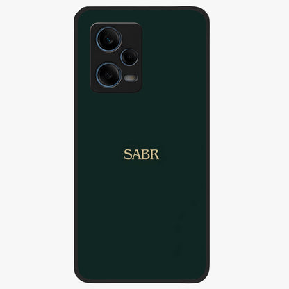 Sabr Minimal Patience Glass Case showing flat back view with minimalist typography artwork and glossy glass finish.