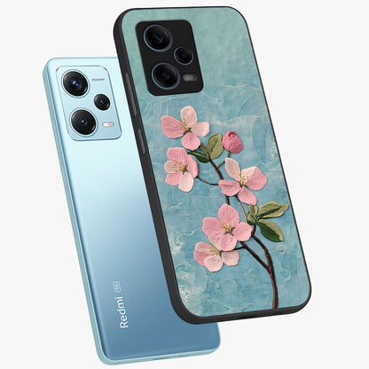 Threaded Blossom Breeze Glass Case displayed in angled mockup highlighting elegant floral design with soft aesthetic style.
