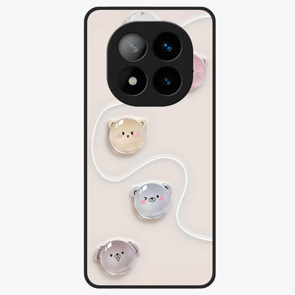 Puffy Face Parade Glass Case showing flat back view with cute puffy character faces artwork and glossy glass finish.
