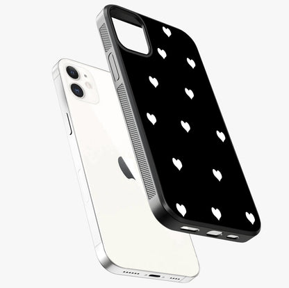 Cute And Simple White Hearts Glass Case laid diagonally highlighting side profile, edges and glossy glass shine.