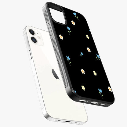 Minimalistic Blue With White Flower Pattern Glass Case laid diagonally highlighting side profile, edges and glossy glass shine.