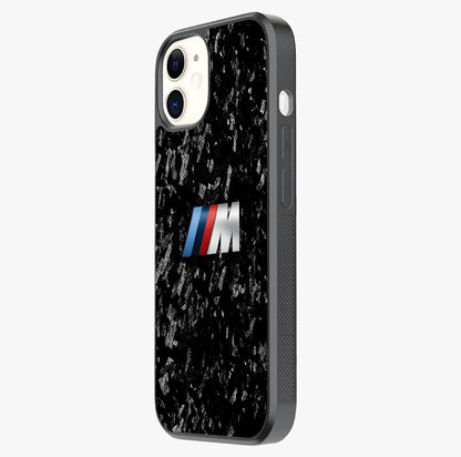 Carbon Speed Mark Glass Case photographed in natural light showing reflective finish and design depth.