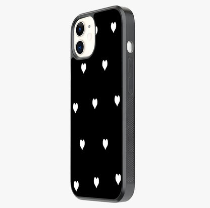 Cute And Simple White Hearts Glass Case photographed in natural light showing reflective finish and design depth.