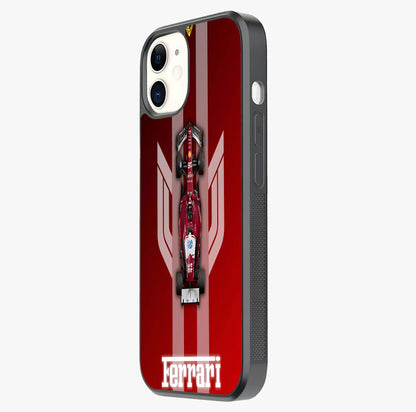 Red Ferrari F1 Vertical Glass Case photographed in natural light showing reflective finish and design depth.