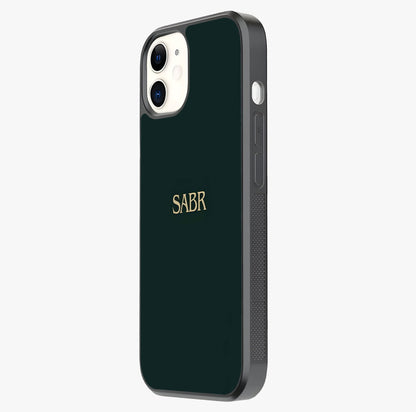 Sabr Minimal Patience Glass Case photographed in natural light showing reflective finish and design depth.